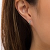 Thumbnail Image 1 of Emerald Huggie Hoop Earrings in 10K White Gold