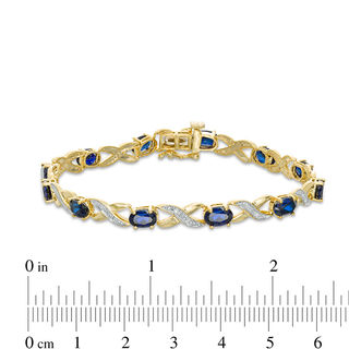Oval Lab-Created Blue Sapphire and Diamond Accent "XO" Bracelet in 10K Gold|Peoples Jewellers