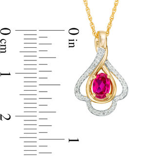 Oval Lab-Created Ruby and 0.148 CT. T.W. Diamond Teardrop Frame Leaf Pendant in 10K White, Yellow or Rose Gold|Peoples Jewellers