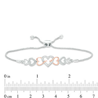 0.04 CT. T.W. Diamond Intertwining Sideways Heart Bolo Bracelet in Sterling Silver and 10K Rose Gold - 9.5"|Peoples Jewellers