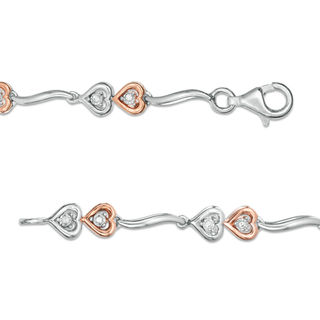 0.087 CT. T.W. Diamond Double Heart Wave Bracelet in Sterling Silver and 10K Rose Gold - 7.5"|Peoples Jewellers