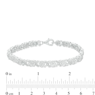 0.23 CT. T.W. Diamond Floral "XO" Link Bracelet in Sterling Silver - 7.25"|Peoples Jewellers