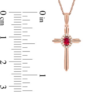 Oval Ruby and 0.04 CT. T.W. Diamond Frame Layered Cross Pendant in 10K Rose Gold|Peoples Jewellers