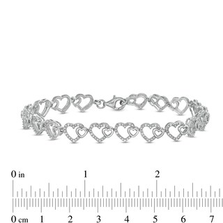 0.25 CT. T.W. Diamond Hearts Line Bracelet in Sterling Silver - 7.5"|Peoples Jewellers