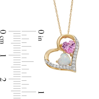 Lab-Created Opal, Pink Lab-Created Sapphire and 0.09 CT. T.W. Diamond Tilted Triple Heart Pendant in 10K Gold|Peoples Jewellers