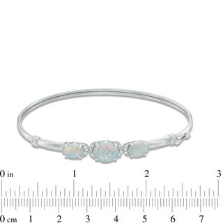 Previously Owned - Oval Lab-Created Opal and White Sapphire Three Stone Bangle in Sterling Silver|Peoples Jewellers