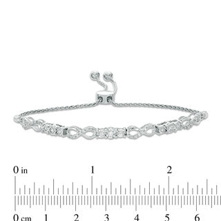 Previously Owned - 0.37 CT. T.W. Diamond Three Stone Infinity Bolo Bracelet in 10K White Gold