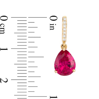 Previously Owned - Pear-Shaped Lab-Created Ruby and 0.067 CT. T.W. Diamond Drop Earrings in 10K Gold|Peoples Jewellers