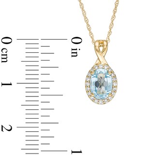 Previously Owned - Oval Swiss Blue Topaz and 0.08 CT. T.W. Diamond Frame Twisted Split Bail Pendant in 10K Gold|Peoples Jewellers