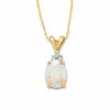 Thumbnail Image 0 of Oval Opal Pendant in 10K Gold with Tri-Top Diamond Accents