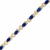 Thumbnail Image 0 of Oval Sapphire and Diamond Accent X Bracelet in 10K Gold - 7.25"