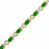 Thumbnail Image 0 of Oval Emerald and Diamond Accent X Bracelet in 10K Gold - 7.25"