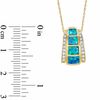 Cabochon Lab-Created Opal Inlay and 0.10 CT. T.W. Diamond Pendant in 10K Gold