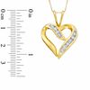 0.50 CT. T.W. Diamond Channel Crossover Heart Pendant in 10K Gold