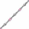 Thumbnail Image 0 of Oval Pink Sapphire Wave Bracelet in 10K White Gold with Diamond Accents