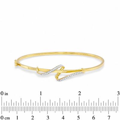 0.21 CT. T.W. Diamond Swirl Bangle in 10K Gold