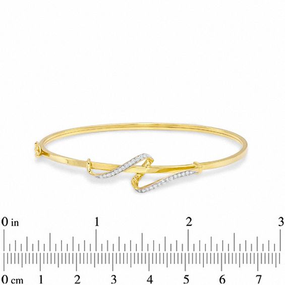 0.21 CT. T.W. Diamond Swirl Bangle in 10K Gold