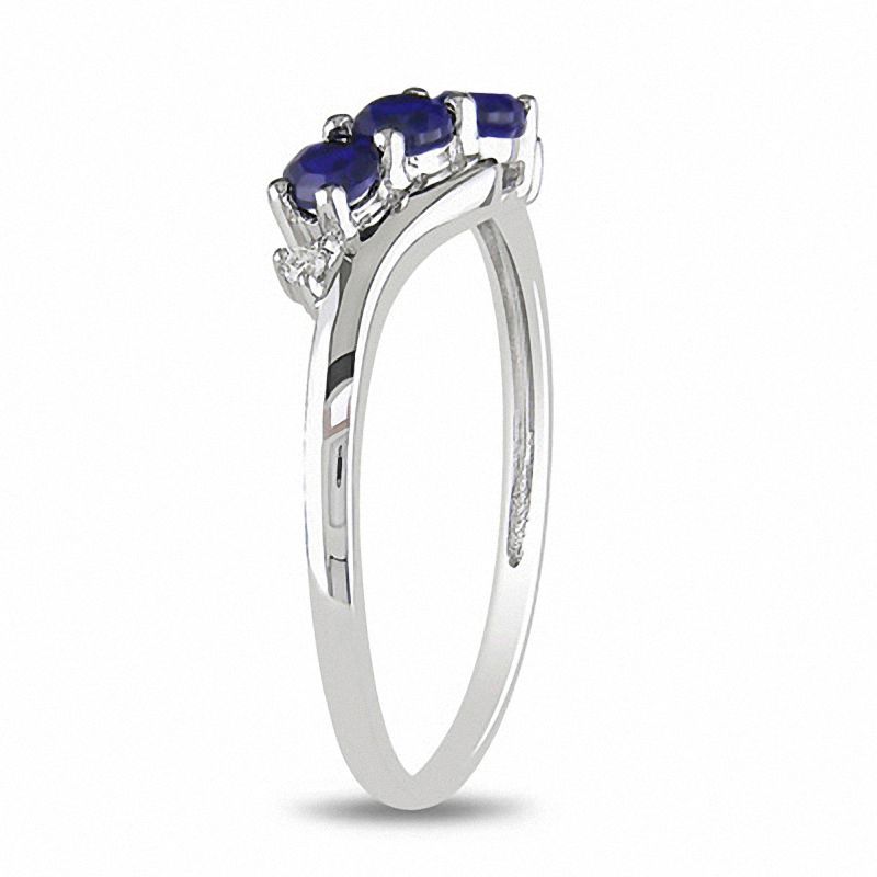 Lab-Created Blue Sapphire Three Stone Slant Ring in 10K White Gold with Diamond Accents|Peoples Jewellers