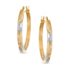 Thumbnail Image 0 of Oval Diamond-Cut Hoop Earrings in 14K Two-Tone Gold