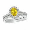 Certified Oval Yellow Sapphire and 0.46 CT. T.W. Diamond Bridal Set in 14K White Gold