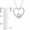 0.12 CT. T.W. Diamond Double Heart Pendant in 10K White Gold