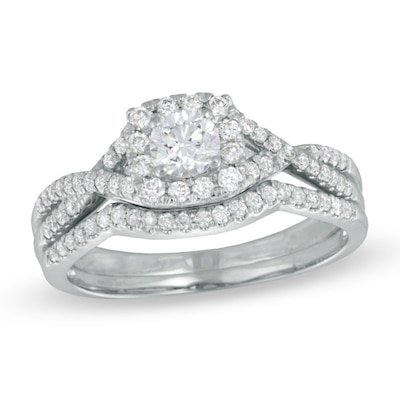 0.70 CT. T.W. Certified Canadian Diamond Twist Shank Bridal Set in 14K White Gold (I/I1)