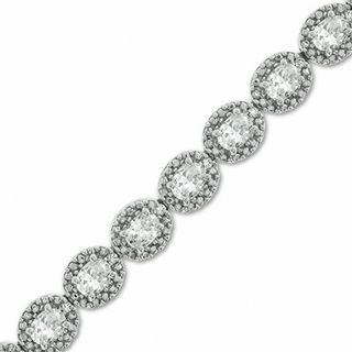 Oval Lab-Created Sapphire and 0.075 CT. T.W. Diamond Bracelet in Sterling Silver