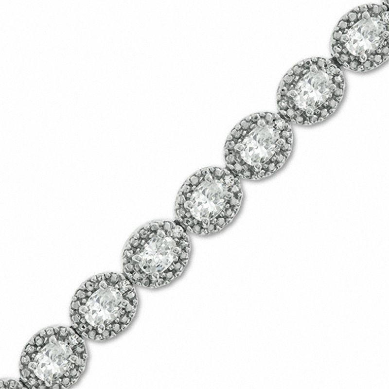 Oval Lab-Created Sapphire and 0.075 CT. T.W. Diamond Bracelet in Sterling Silver