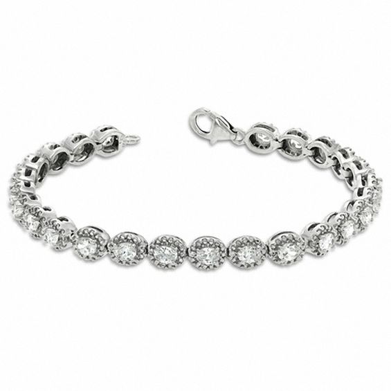 Oval Lab-Created Sapphire and 0.075 CT. T.W. Diamond Bracelet in Sterling Silver