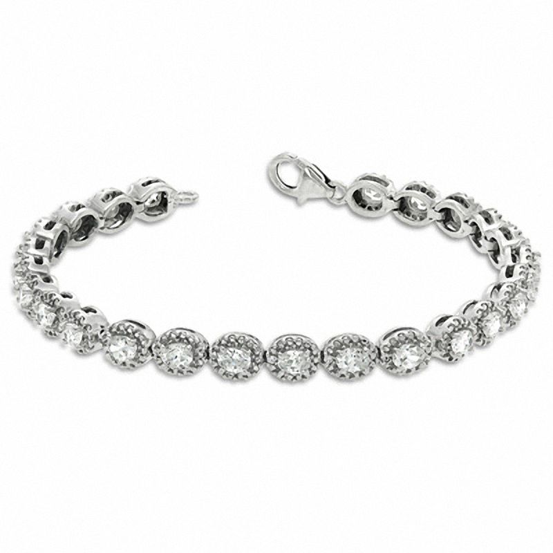 Oval White Lab-Created Sapphire and 0.075 CT. T.W. Diamond Bracelet in Sterling Silver - 7.5"