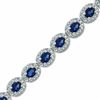 Thumbnail Image 1 of Oval Blue Lab-Created Sapphire and 0.075 CT. T.W. Diamond Bracelet in Sterling Silver - 7.5&quot;