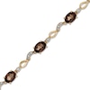 Thumbnail Image 0 of Oval Smoky Quartz and Diamond Accent Bracelet in 10K Gold - 7.25"