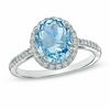 Oval Aquamarine and 0.20 CT. T.W. Diamond Frame Ring in 10K White Gold