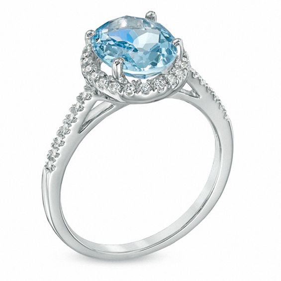 Oval Aquamarine and 0.20 CT. T.W. Diamond Frame Ring in 10K White Gold