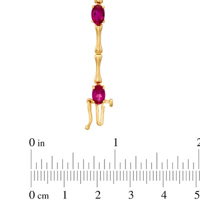 Oval Lab-Created Ruby Bracelet in Sterling Silver with 14K Gold Plate - 7.25"