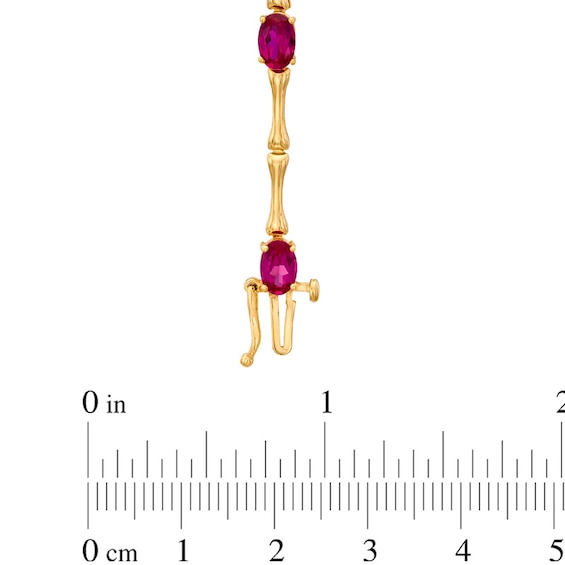 Oval Lab-Created Ruby Bracelet in Sterling Silver with 14K Gold Plate - 7.25"