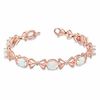 Thumbnail Image 1 of Oval Lab-Created Opal and Diamond Accent Milgrain Bow Bracelet in Sterling Silver with 14K Rose Gold Plate - 7.25"