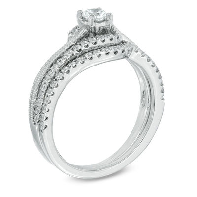 0.50 CT. T.W. Diamond Frame Swirl Bridal Set in 10K White Gold