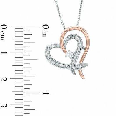 0.18 CT. T.W. Certified Canadian Diamond Ribbon Heart Pendant in Sterling Silver and 10K Rose Gold (I/I2)