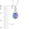 Oval Tanzanite and 0.14 CT. T.W. Princess-Cut Diamond Twist Pendant in 10K White Gold