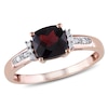 Thumbnail Image 0 of 6.0mm Cushion-Cut Garnet and 0.05 CT. T.W. Diamond Ring in 10K Rose Gold