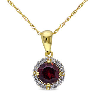 Oval Ruby and 0.04 CT. T.W. Diamond Tri-Top Pendant in 10K Gold