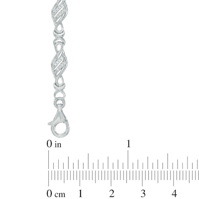 0.23 CT. T.W. Diamond Flame and "X" Link Bracelet in Sterling Silver - 7.5"