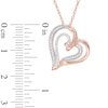 0.15 CT. T.W. Diamond Tilted Ribbon Heart Pendant in 10K Rose Gold