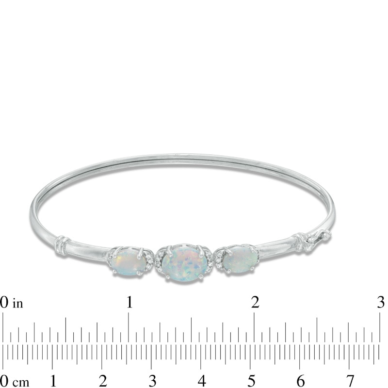 Oval Lab-Created Opal and White Sapphire Three Stone Bangle in Sterling Silver
