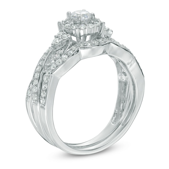 0.58 CT. T.W. Diamond Frame Twist Bridal Set in 10K White Gold