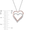 Thumbnail Image 1 of 0.09 CT. T.W. Diamond Double Heart Pendant in 10K Two-Tone Gold