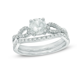 6.0mm Lab-Created White Sapphire and 0.15 CT. T.W. Diamond Twist Bridal Set in 10K White Gold