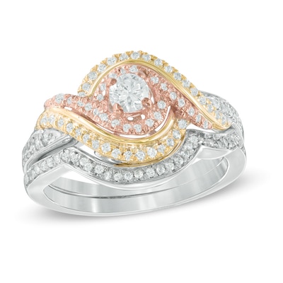 0.45 CT. T.W. Diamond Swirl Bypass Bridal Set in 10K Tri-Tone Gold