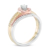 0.31 CT. T.W. Diamond Swirl Bridal Set in 10K Tri-Tone Gold